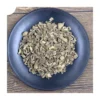 Dried acanthopanax root bark slices in a dark ceramic bowl