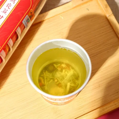Close-up detail of burdock dandelion goji herbal tea in cup