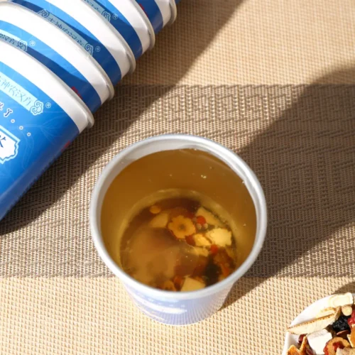 Close-up detail of mulberry red date longan herbal tea in cup